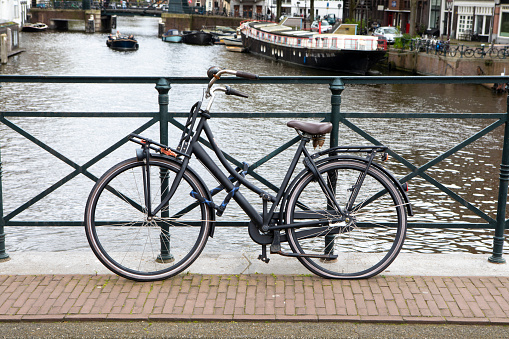 Bicycle by a canal in Amsterdam