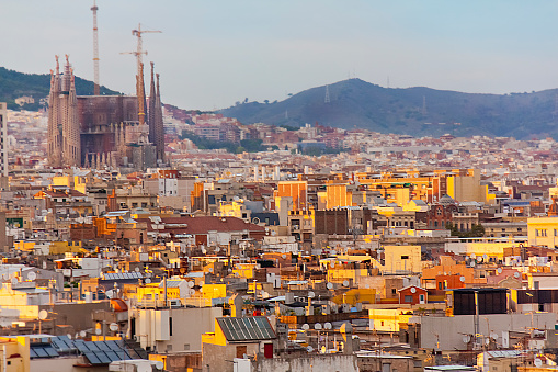 Cityscape in Barcelona seen from viewpoint, image suitable for backgrounds , Catalonia, Spain. Sagrada Familia church in the background.