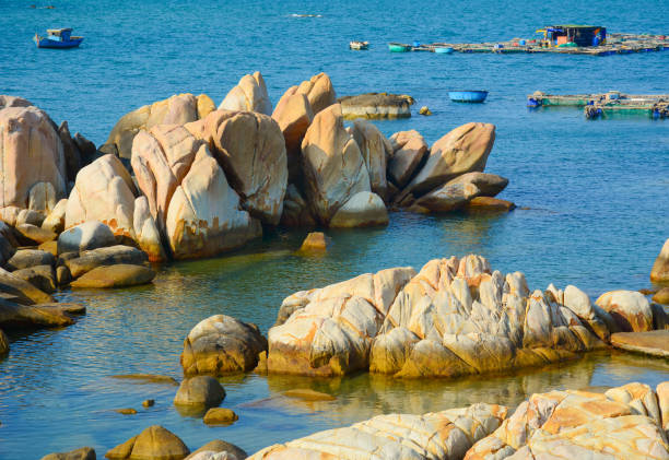 Idyllic tropical beach in sunny day. Rocks on the sea.