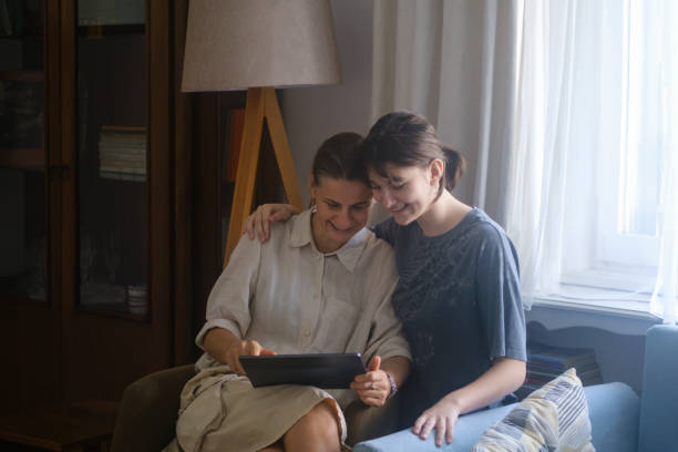 istock Mother and teenager girl using online application 1622980625