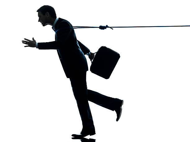 istock business man catched by lasso rope silhouette 162300372