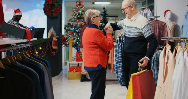 istock Happy senior couple dancing in store 1623021303