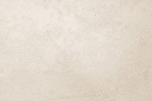 istock Colour old concrete wall texture background. Close Up retro plain cream color cement wall background texture. Design paper vintage parchment element show or advertise or promote product on display. 1623025279