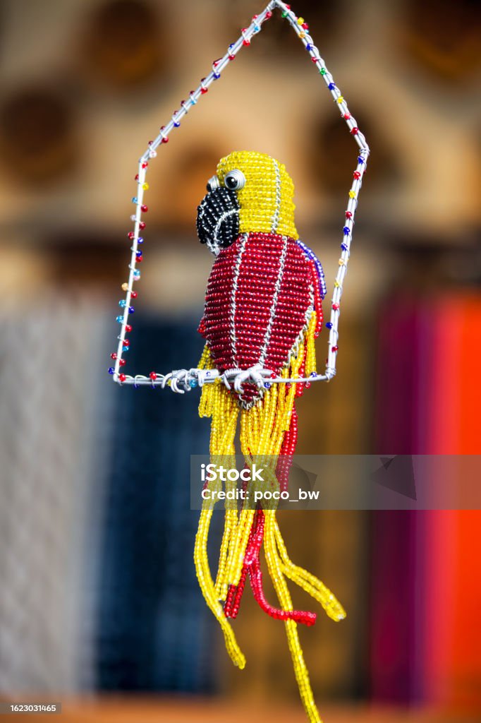 art african parrot handmade from wire and beads african art souvenirs for tourists parrot handmade from wire and beads Africa Stock Photo