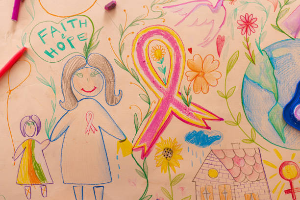 Woman drawing a cute pink ribbon for breast cancer month