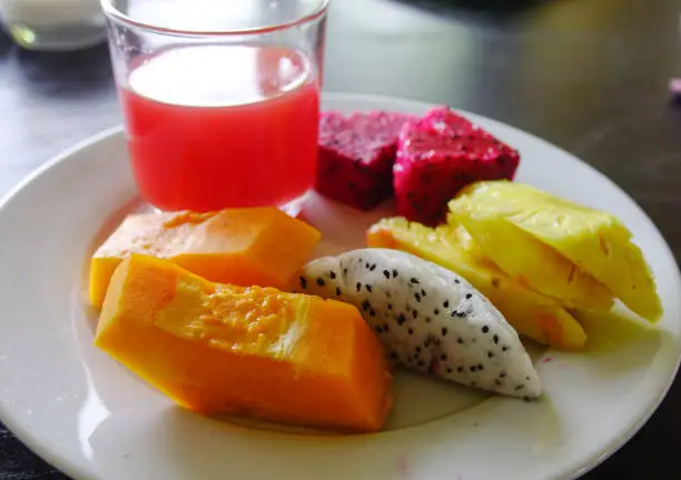 Photo of Plate with tropical fruits for breakfast