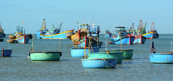 Fishing boats docking on the sea in Binh Thuan, Vietnam. Binh Thuan Province is known for its beaches and coastal roads.