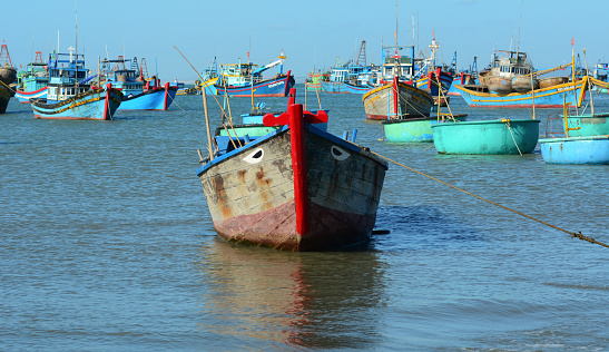 Fishing boats on the sea in Binh Thuan, Vietnam. Binh Thuan Province is known for its beaches and coastal roads.