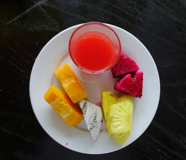 Photo of Plate with tropical fruits on dish