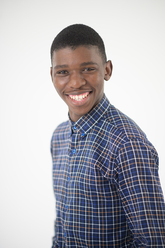Happy Young Handsome African male studio portrait
