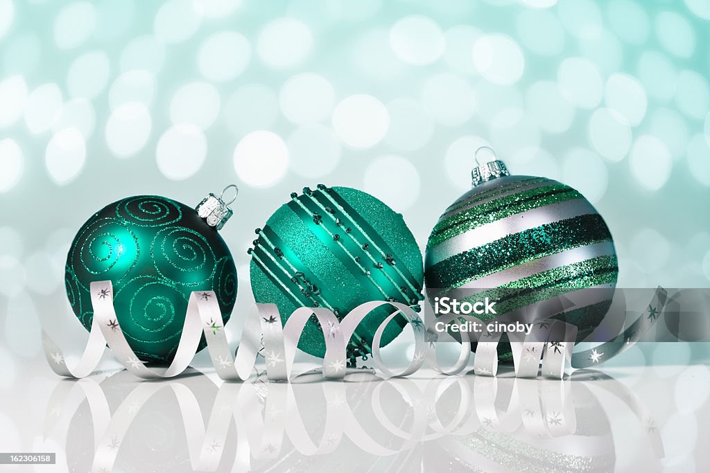 Turquoise Christmas Bauble Christmas decoration in turquoise with Christmas bauble and ribbon Blue Stock Photo