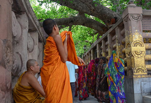 Bodhgaya, India - Jul 9, 2015. Buddhist monks at Mahabodhi Temple in Bodhgaya, India. Bodh Gaya is considered one of the most important Buddhist pilgrimage sites.