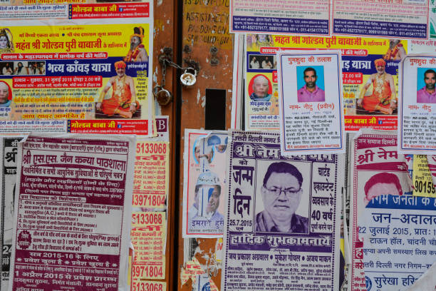 Agra, India - Jul 26, 2015. Old poster wall in Agra, India. Agra is included on the Golden Triangle tourist circuit, along with Delhi and Jaipur.