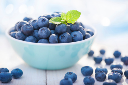 Close-up of fresh blueberries on a white plate