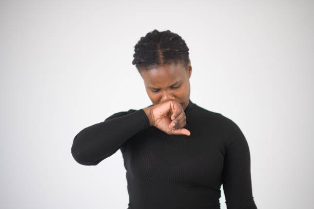 istock Woman Coughing sneezing into hand 1623087358