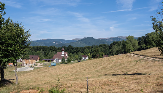 Bumbesti-Jiu, Gorj, Romania – July 29, 2023: The church and hermitage of St. John the Baptizer, at the foothill of the mountain Parang. It is a hermitage of old rite Christian monks.