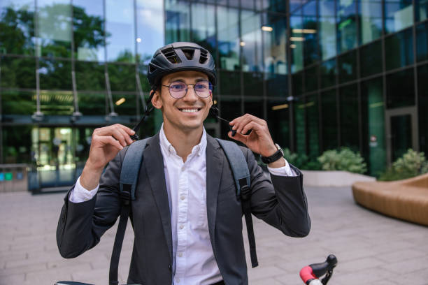 istock Young businessman wearing protective hemlet before cycling 1623100208