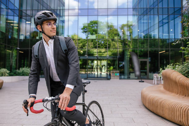 istock Businessman riding a bicycle and looking contented 1623100726