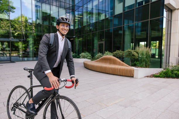 istock Businessman riding a bicycle and looking contented 1623100738