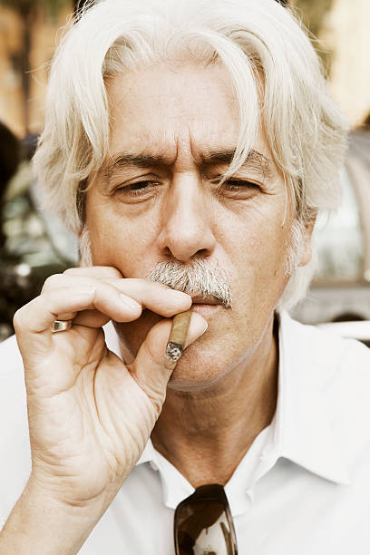 istock Mature man smoking cigar 162310504