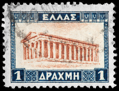 Partenon on Greek Vintage Postage Stamp. The Parthenon  is a temple in the Athenian Acropolis, Greece, dedicated to the Greek goddess Athena, whom the people of Athens considered their protector. Its construction began in 447 BC and was completed in 438 BC, In the 1200's the Parthenon was converted to a Christian church and then converted into a Mosque in the 1400's.