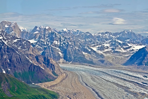Aerieal view of peaks and valleys of Denali National Park mountain range with blue skies and copy space, Alaska.