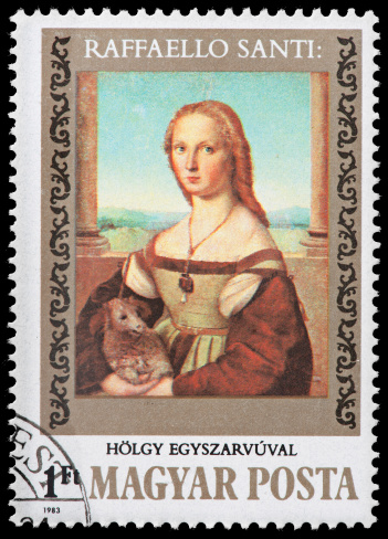 Vintage Hungarian Postage Stamp Depicting Raffaello Santi Painting. Raffaello - Sanzio da Urbino 1483 – 1520, better known simply as Raphael, was an Italian painter and architect of the High Renaissance and was celebrated for the perfection and grace of his paintings and drawings. Together with Michelangelo and Leonardo da Vinci, he forms the traditional trinity of great masters of that period. - Raphael was enormously productive, and despite his death at thirty-seven, a large body of his work remains.