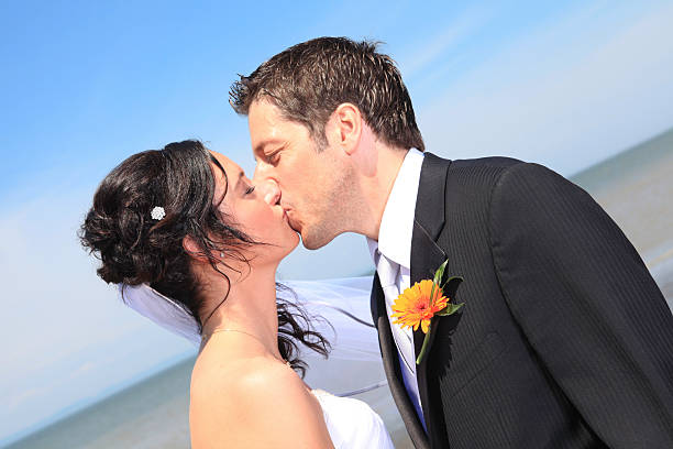 istock Wedding Couple - Kiss Ocean on Back 162315080