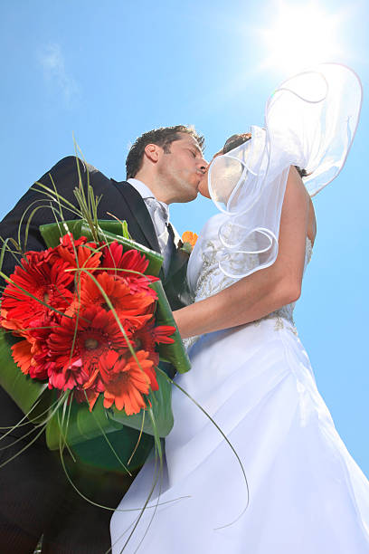 istock Wedding Couple - Back Lit Kiss 162315083