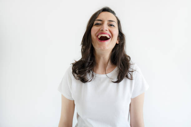 portrait of an attractive young woman posing against a white background