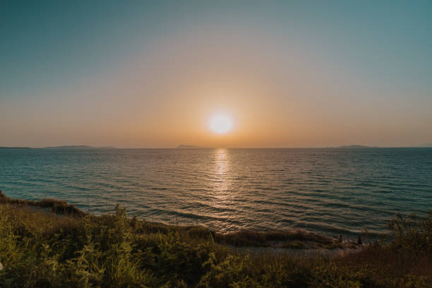 Scenic ocean with sky in background seen from mountain during sunset, Corfu, Greece