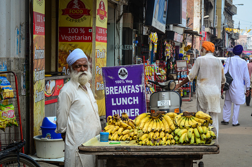 Amritsar, India - Jul 25, 2015. A vendor selling banana in Amritsar, India. Amritsar is home to the Harmandir Sahib, the spiritual and cultural centre for the Sikh religion.