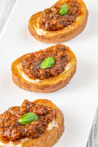istock Ciabatta bruschettas with mozzarella and puttanesca 1623182547
