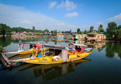 Srinagar, India - Jul 24, 2015. Traditional boats waiting passengers on Dal Lake in Srinagar, India. Srinagar is the summer capital of the Indian state of Jammu and Kashmir.