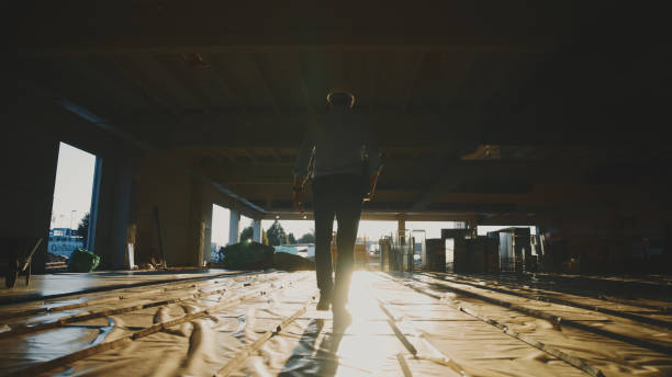 istock Mature male building contractor walking at under development site 1623197513