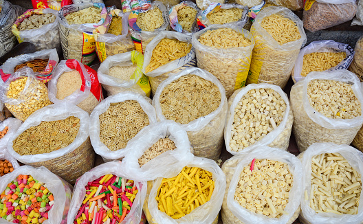 Dried foods for sale at local market in Old Delhi, India.