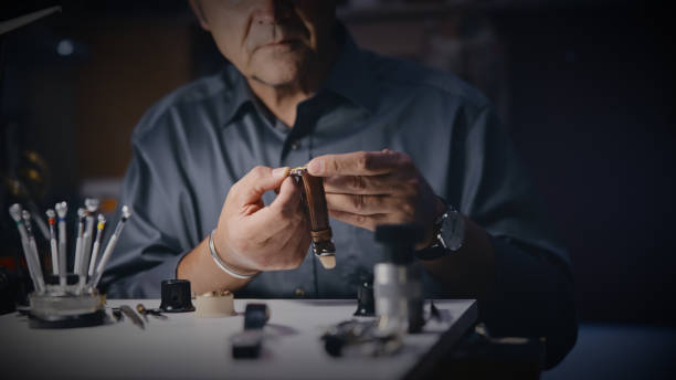 istock Mature repairman analyzing watch at workshop 1623203291