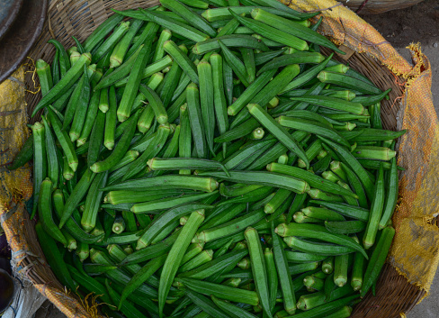 Fresh green okra at the farmer market in New Delhi, India.