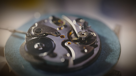 Clockwork gears in the workshop,intricately interlocking,creating a symphony of mechanical precision