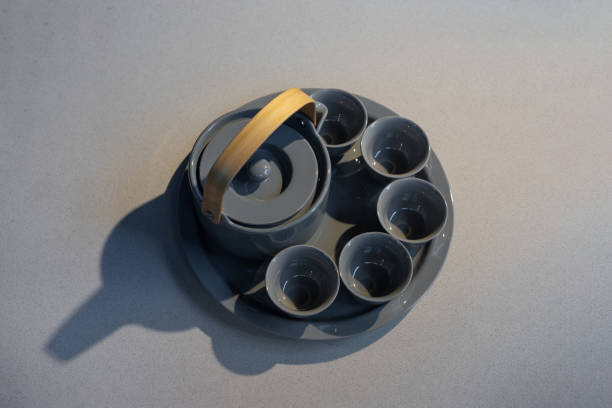 TeaPot ceramic set with New contemporary Modern and Vintage combination style on flat stone kitchen counter with sunlight from window.