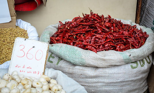 Dried red chilli peppers for sale at local market in Old Delhi, India.