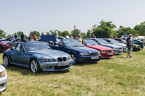 Tarporley, Cheshire, England, June 3rd 2023. Blue BMW Z4 and BMW 3 Series Convertible at a classic car meet.