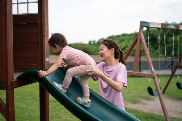 istock Mother and daughter at the playground 1623242168