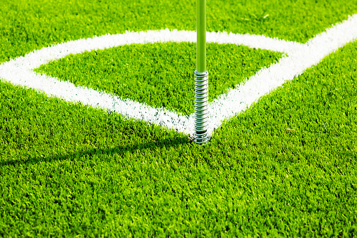 Corner marking of soccer field with artificial grass