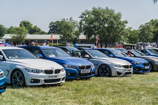 Tarporley, Cheshire, England, June 3rd 2023. Row of BMWs at a car meet, automotive lifestyle editorial illustration.
