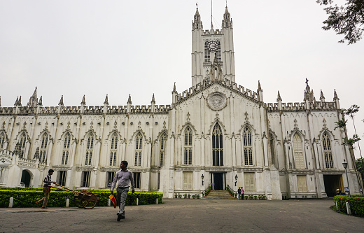 Kolkata, India - Jul 8, 2015. People visiting the St. Paul Cathedral in Kolkata, India. The Cathedral is an Anglican cathedral in Kolkata, noted for its Gothic architecture.