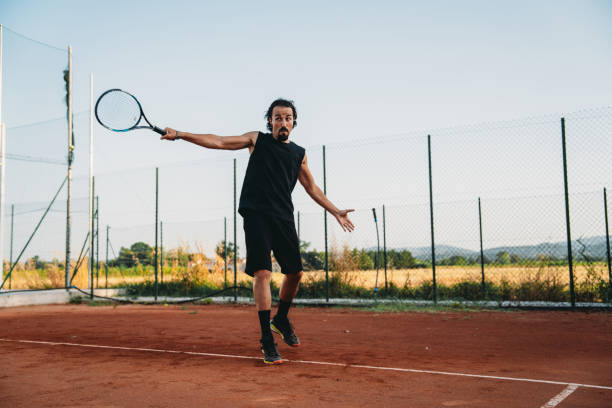 istock A tennis player is playing on court 1623255138