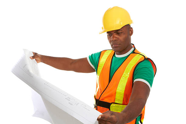 istock Serious african american construction worker holding blueprints 162327406