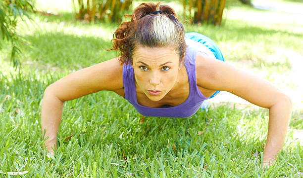 istock Woman Doing Push Ups In Park 162329717