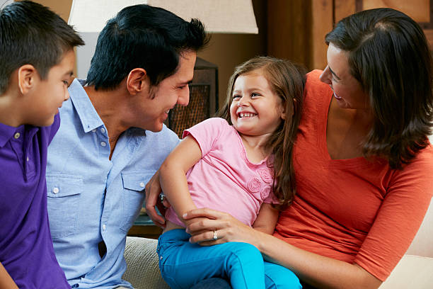 istock Family Sitting On Sofa At Home Together 162329845
